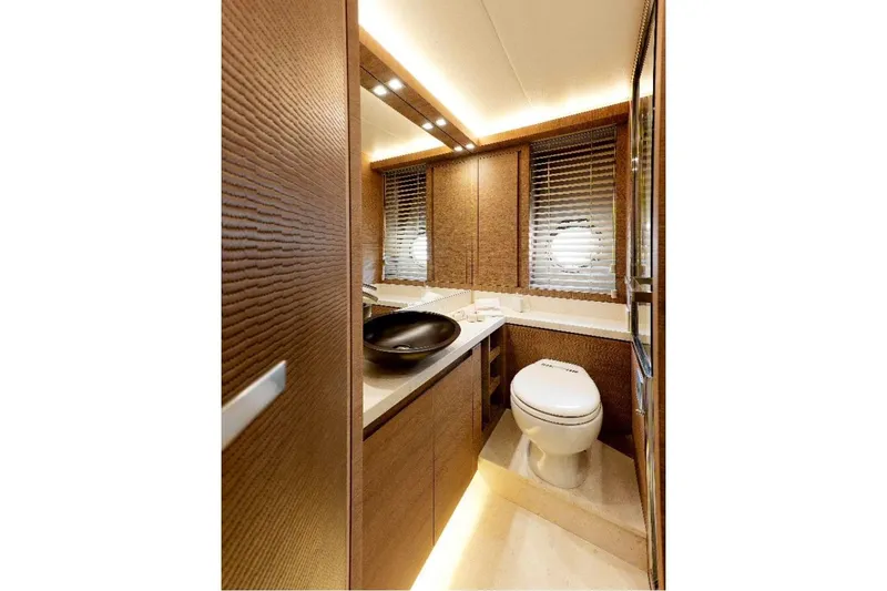 Tyche Yacht Photos Pics Luxurious bathroom interior of 2019 Monte Carlo Yachts MCY 76 with modern fixtures.