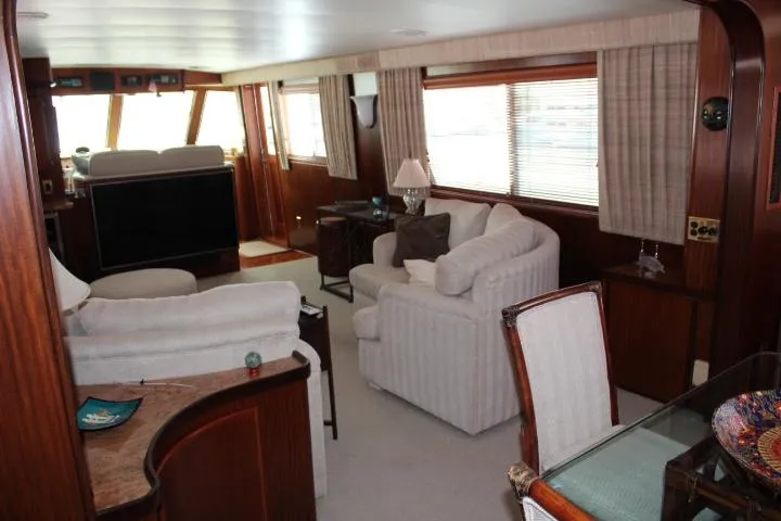 Eternity Yacht Photos Pics Interior of 1985 Hatteras 58 Motor Yacht with elegant seating and large windows.