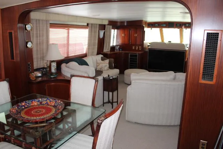 Eternity Yacht Photos Pics Interior of 1985 Hatteras 58 Motor Yacht with elegant dining and living area.