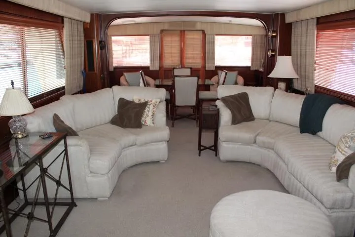 Eternity Yacht Photos Pics Luxurious interior of 1985 Hatteras 58 Motor Yacht with plush seating and elegant decor.