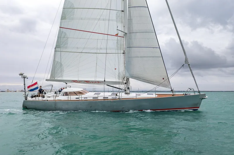 Red Rooster Yacht Photos Pics Sailing yacht Van De Stadt Stadtship 70, 2008, on open water with Dutch flag.