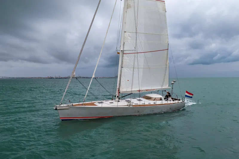 Red Rooster Yacht Photos Pics Sailing yacht Van De Stadt Stadtship 70, 2008, on open sea under cloudy skies.