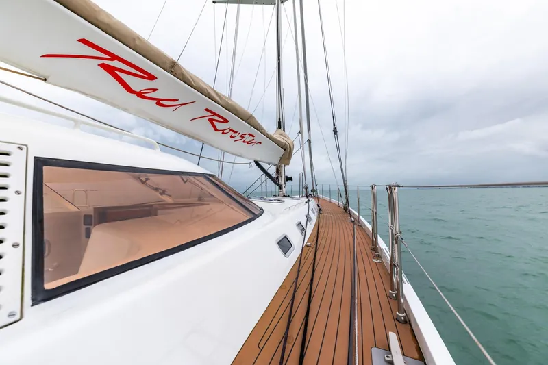 Red Rooster Yacht Photos Pics Sailing yacht Van De Stadt Stadtship 70, 2008 model, on open water with teak deck.