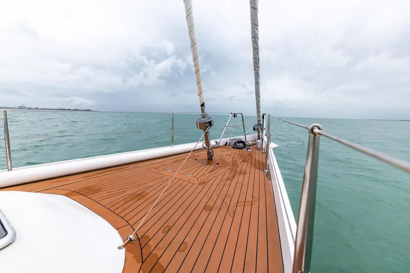 Red Rooster Yacht Photos Pics Deck view of 2008 Van De Stadt Stadtship 70 sailing on calm sea.