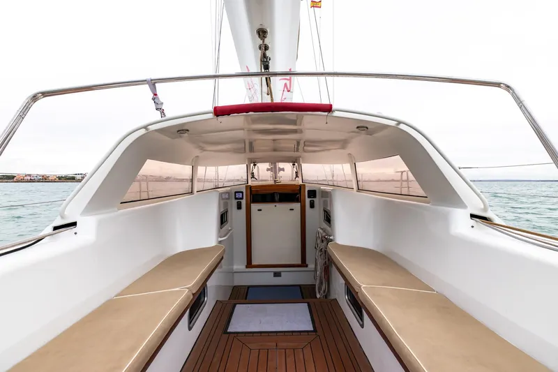 Red Rooster Yacht Photos Pics 2008 Van De Stadt Stadtship 70 yacht cockpit with teak flooring and cushioned seating.
