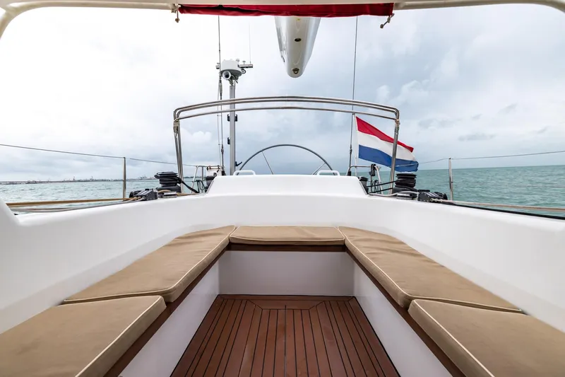 Red Rooster Yacht Photos Pics Van De Stadt Stadtship 70 yacht deck with seating, ocean view, and flag, 2008 model.