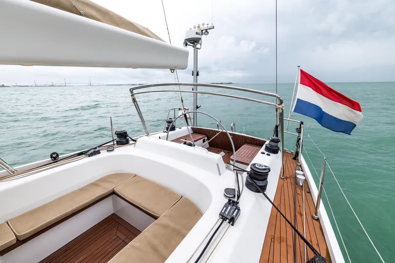 Red Rooster Yacht Photos Pics Luxurious 2008 Van De Stadt Stadtship 70 yacht with Dutch flag, sailing on calm waters.