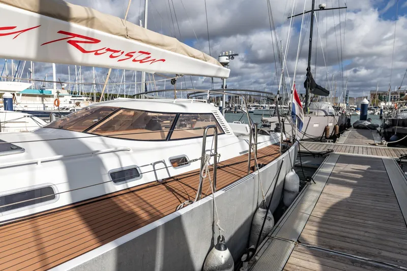 Red Rooster Yacht Photos Pics Van De Stadt Stadtship 70 yacht docked at marina, 2008 model, with sleek design and wooden deck.