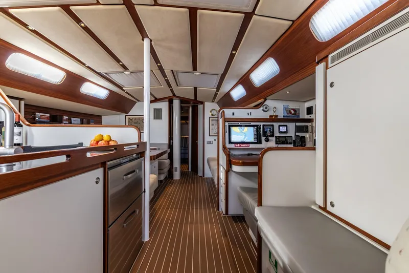 Red Rooster Yacht Photos Pics Luxurious interior of 2008 Van De Stadt Stadtship 70 yacht with modern amenities and wood accents.