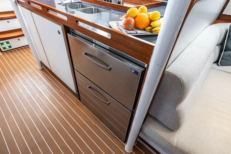 Red Rooster Yacht Photos Pics Luxurious 2008 Van De Stadt Stadtship 70 yacht interior with modern kitchen and cozy seating.