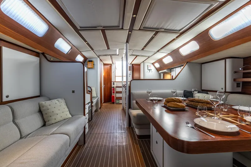 Red Rooster Yacht Photos Pics Luxurious interior of 2008 Van De Stadt Stadtship 70 yacht with elegant dining area.