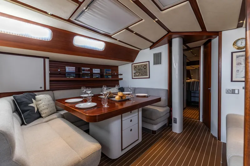 Red Rooster Yacht Photos Pics Luxurious interior of 2008 Van De Stadt Stadtship 70 yacht with elegant dining area.