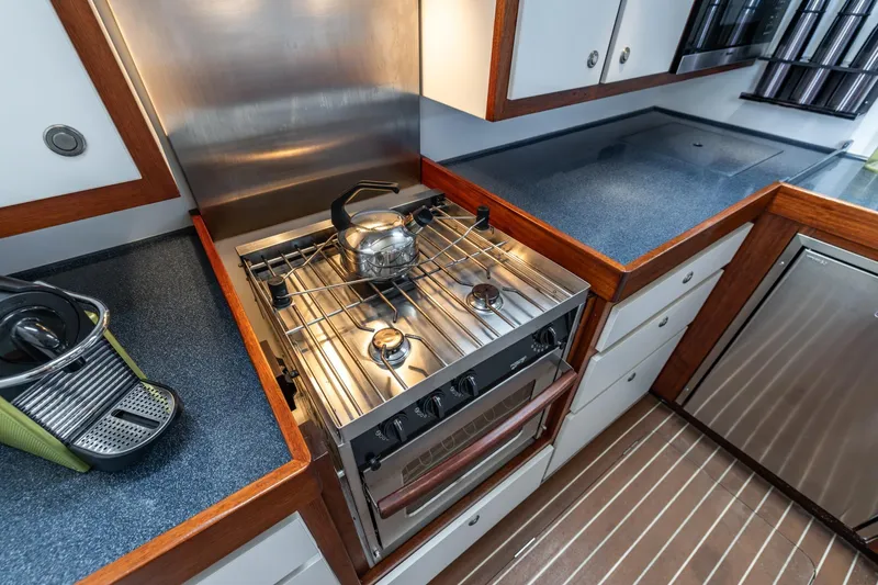 Red Rooster Yacht Photos Pics Modern kitchen in 2008 Van De Stadt Stadtship 70 yacht with stove and appliances.