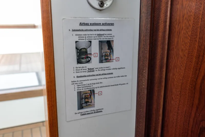 Red Rooster Yacht Photos Pics Instruction panel for airbag system activation on 2008 Van De Stadt Stadtship 70 yacht.