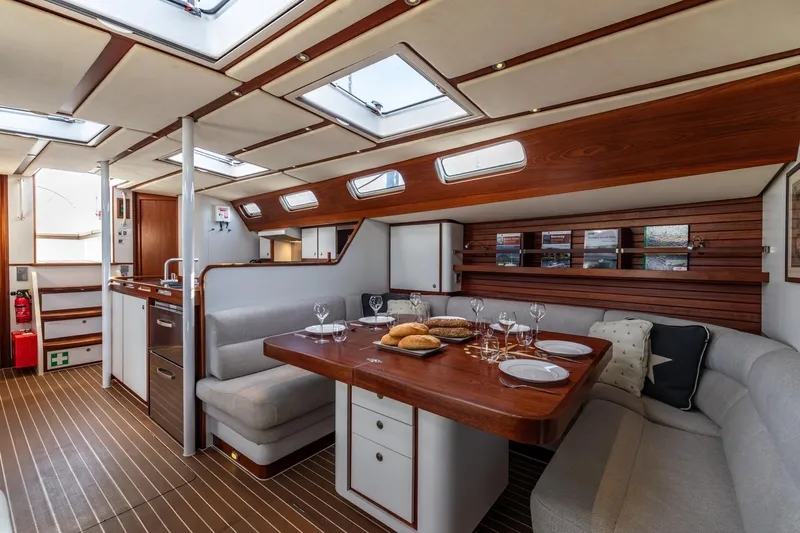 Red Rooster Yacht Photos Pics Luxurious interior of 2008 Van De Stadt Stadtship 70 yacht with elegant dining area.