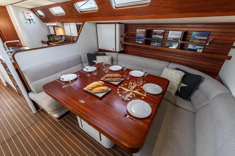 Red Rooster Yacht Photos Pics Luxurious 2008 Van De Stadt Stadtship 70 yacht interior with elegant dining area and wooden accents.