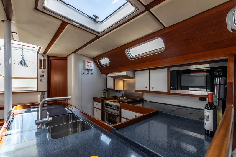 Red Rooster Yacht Photos Pics Luxurious 2008 Van De Stadt Stadtship 70 yacht interior with modern kitchen amenities.