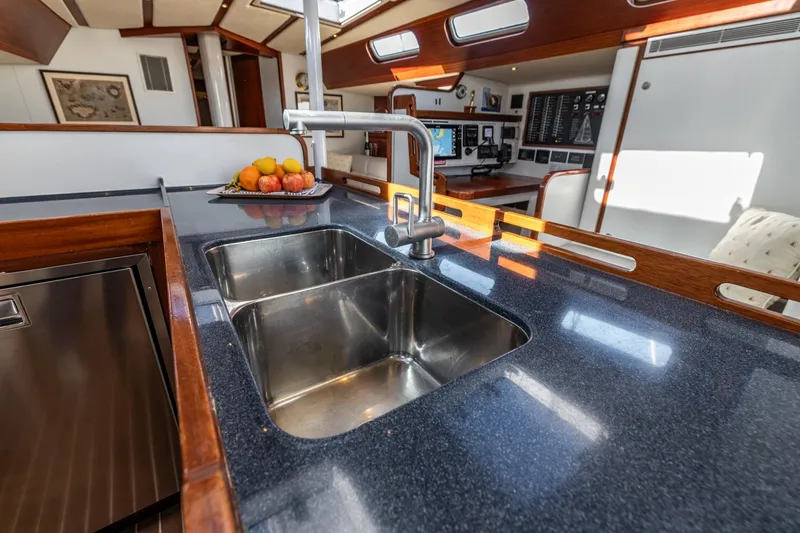 Red Rooster Yacht Photos Pics Luxurious 2008 Van De Stadt Stadtship 70 yacht interior with modern kitchen and fruit display.