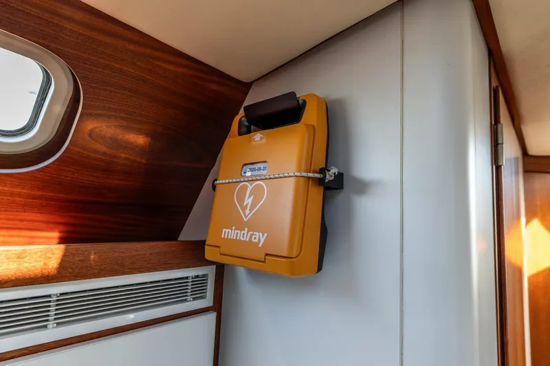 Red Rooster Yacht Photos Pics Yellow defibrillator mounted on a Van De Stadt Stadtship 70 yacht interior, 2008 model.