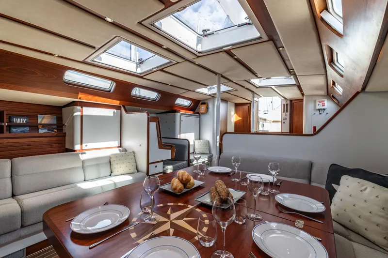 Red Rooster Yacht Photos Pics Luxurious interior of 2008 Van De Stadt Stadtship 70 yacht with elegant dining area.
