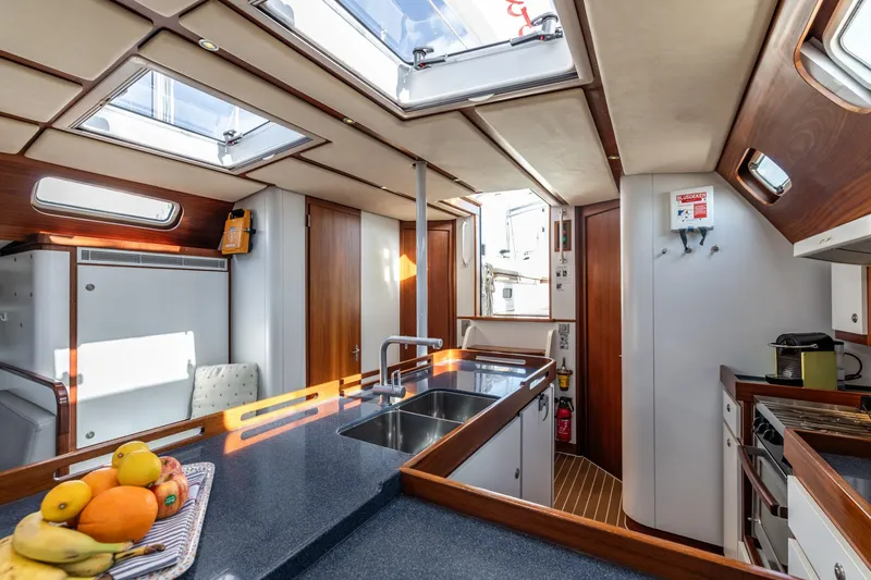 Red Rooster Yacht Photos Pics Luxurious interior of 2008 Van De Stadt Stadtship 70 yacht with modern kitchen amenities.