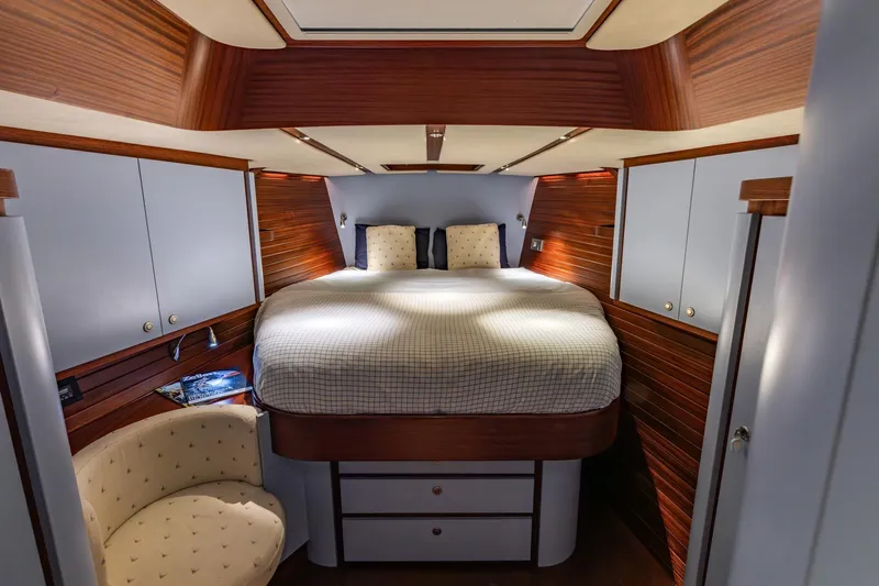 Red Rooster Yacht Photos Pics Luxurious 2008 Van De Stadt Stadtship 70 yacht cabin with elegant wood paneling and cozy bed.