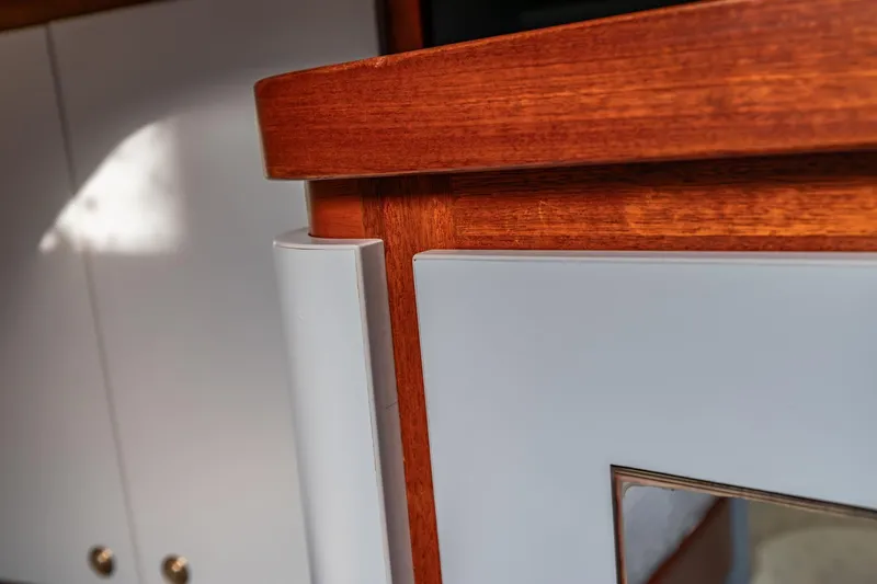 Red Rooster Yacht Photos Pics Interior detail of 2008 Van De Stadt Stadtship 70, featuring wood and white paneling.