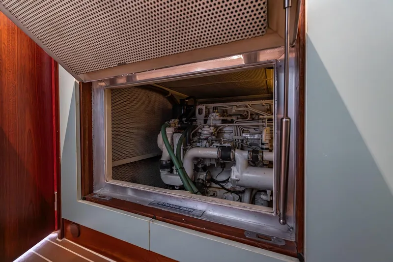 Red Rooster Yacht Photos Pics Engine compartment of 2008 Van De Stadt Stadtship 70 yacht, showcasing mechanical details.