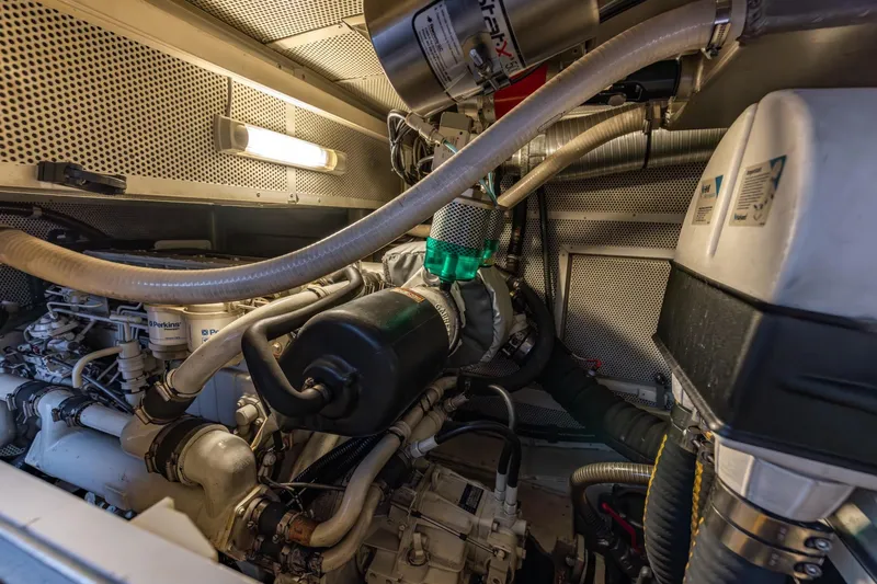 Red Rooster Yacht Photos Pics Engine room of 2008 Van De Stadt Stadtship 70 yacht, showcasing mechanical components.