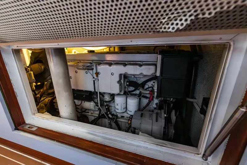 Red Rooster Yacht Photos Pics Engine compartment of 2008 Van De Stadt Stadtship 70 yacht, showcasing mechanical components.
