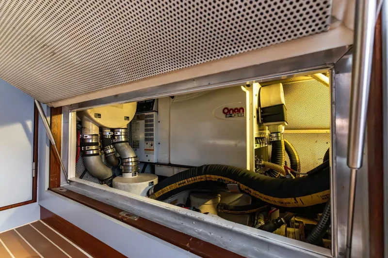 Red Rooster Yacht Photos Pics Engine room of 2008 Van De Stadt Stadtship 70 yacht, featuring Onan generator.