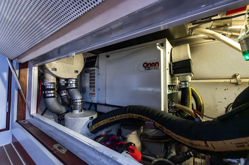 Red Rooster Yacht Photos Pics Engine room of 2008 Van De Stadt Stadtship 70 yacht, featuring Onan generator.
