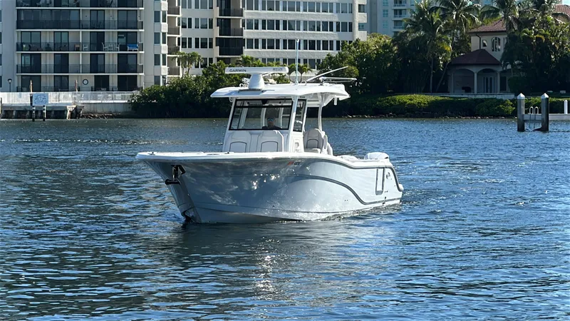Seakeeper And Joystick Yacht Photos Pics 2020 Sea Fox 368 Commander boat on water near urban buildings and greenery.