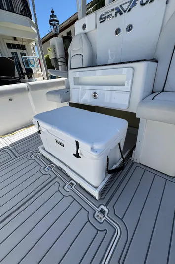 Seakeeper And Joystick Yacht Photos Pics 2020 Sea Fox 368 Commander boat interior with cooler and seating area.