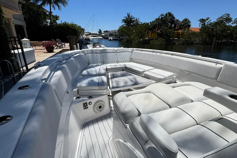 Seakeeper And Joystick Yacht Photos Pics Luxurious seating on 2020 Sea Fox 368 Commander boat, docked by a scenic waterway.