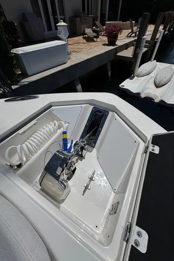 Seakeeper And Joystick Yacht Photos Pics 2020 Sea Fox 368 Commander boat storage compartment with coiled hose and anchor.