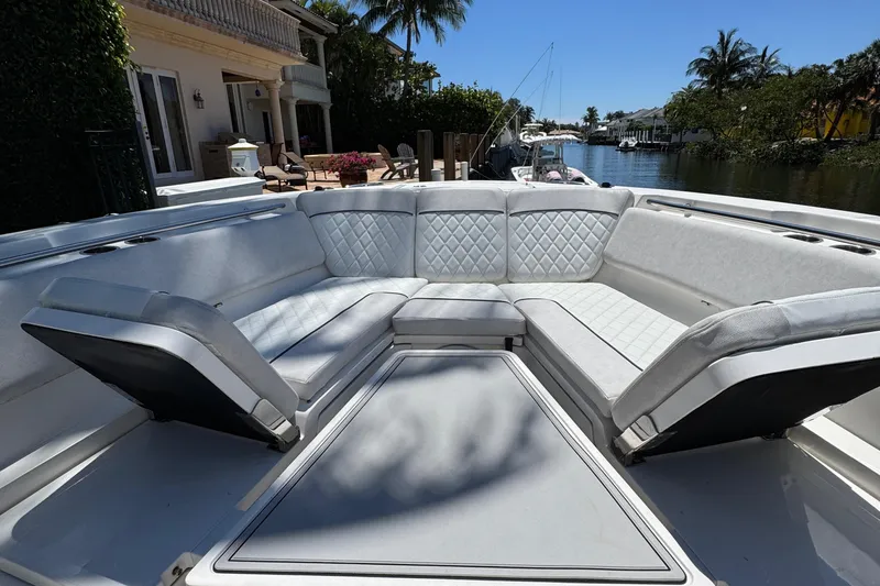 Seakeeper And Joystick Yacht Photos Pics Luxurious seating area on 2020 Sea Fox 368 Commander boat, docked by waterfront homes.