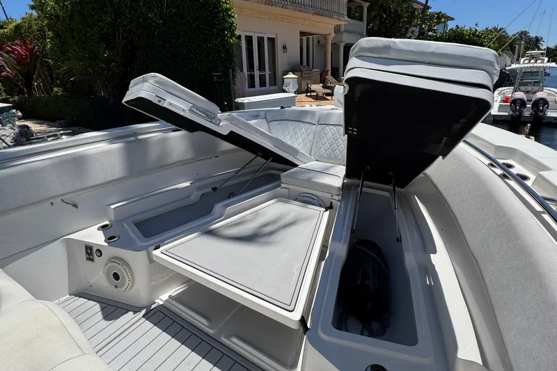Seakeeper And Joystick Yacht Photos Pics 2020 Sea Fox 368 Commander boat with open storage compartments and seating area.