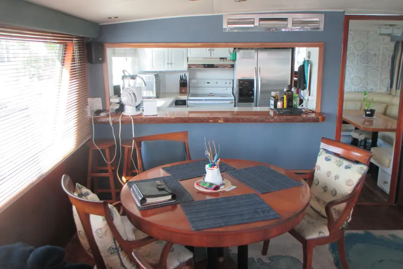 Hattitude Yacht Photos Pics Interior of 1981 Hatteras 61 Motor Yacht with dining area and kitchen.