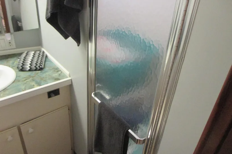 Hattitude Yacht Photos Pics Bathroom interior of 1981 Hatteras 61 Motor Yacht with shower and sink.