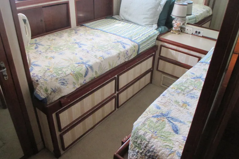Hattitude Yacht Photos Pics Interior of 1981 Hatteras 61 Motor Yacht with twin beds and floral bedding.