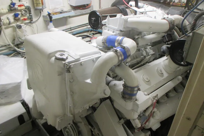 Hattitude Yacht Photos Pics Engine room of 1981 Hatteras 61 Motor Yacht, showcasing detailed machinery components.
