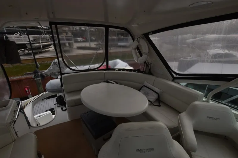 E2rt Yacht Photos Pics Interior of 2006 Carver 46 Voyager yacht with seating and table.
