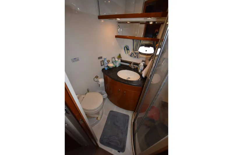 E2rt Yacht Photos Pics Bathroom interior of 2006 Carver 46 Voyager yacht with sink, toilet, and shower.