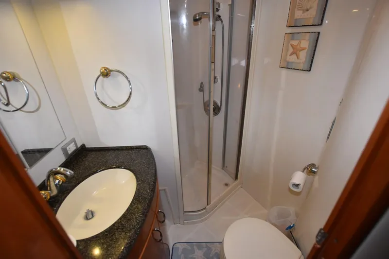 E2rt Yacht Photos Pics Bathroom interior of 2006 Carver 46 Voyager yacht with shower and sink.