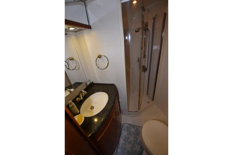 E2rt Yacht Photos Pics Bathroom interior of 2006 Carver 46 Voyager yacht with shower and sink.