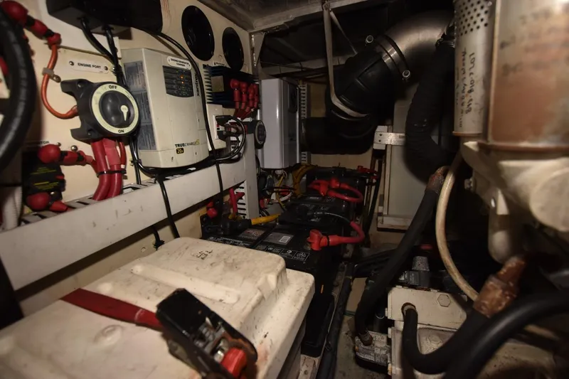 E2rt Yacht Photos Pics Engine room of 2006 Carver 46 Voyager yacht, featuring batteries and electrical components.