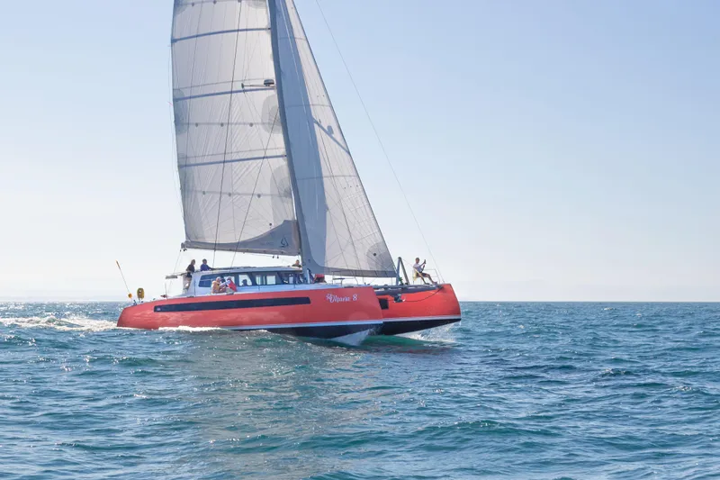 Ohana 8 Yacht Photos Pics Red Balance 526 catamaran sailing on open sea, 2020 model.