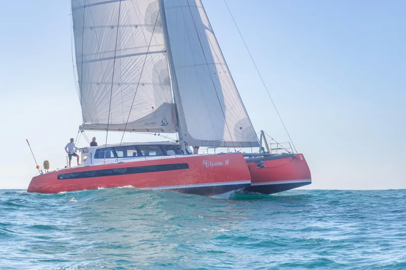 Ohana 8 Yacht Photos Pics Red Balance 526 catamaran sailing on open sea, 2020 model.