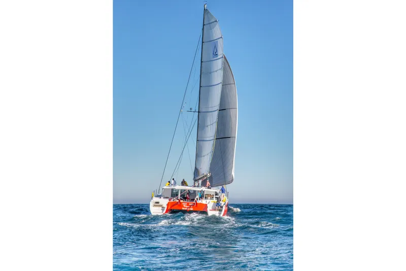 Ohana 8 Yacht Photos Pics Sailing catamaran Balance 526, 2020 model, navigating ocean waters under clear blue skies.
